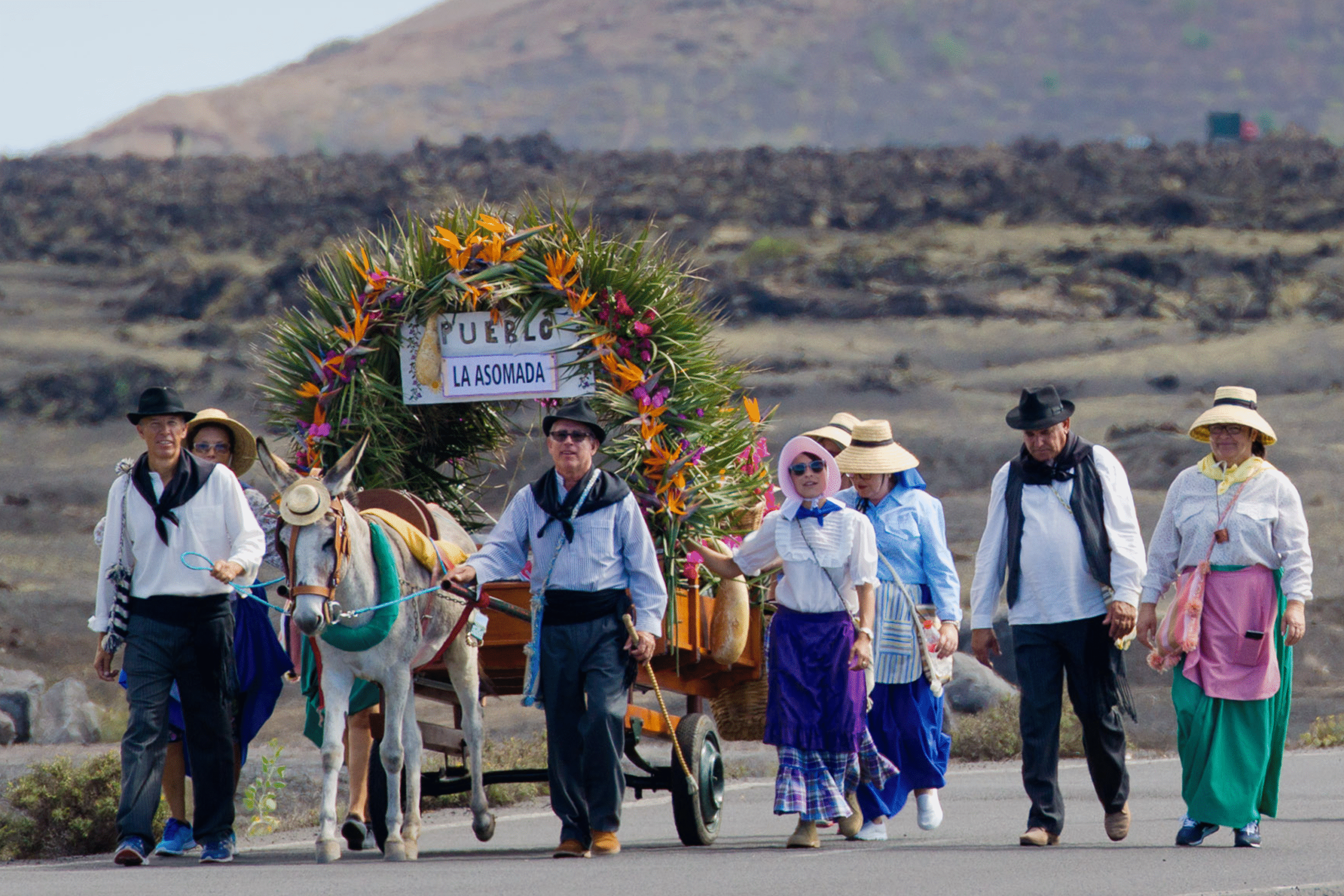 Romería de Los Dolores in Tinajo, pilgrims in traditional dress with offerings Romería de Los Dolores in Tinajo, pilgrims in traditional dress with offerings