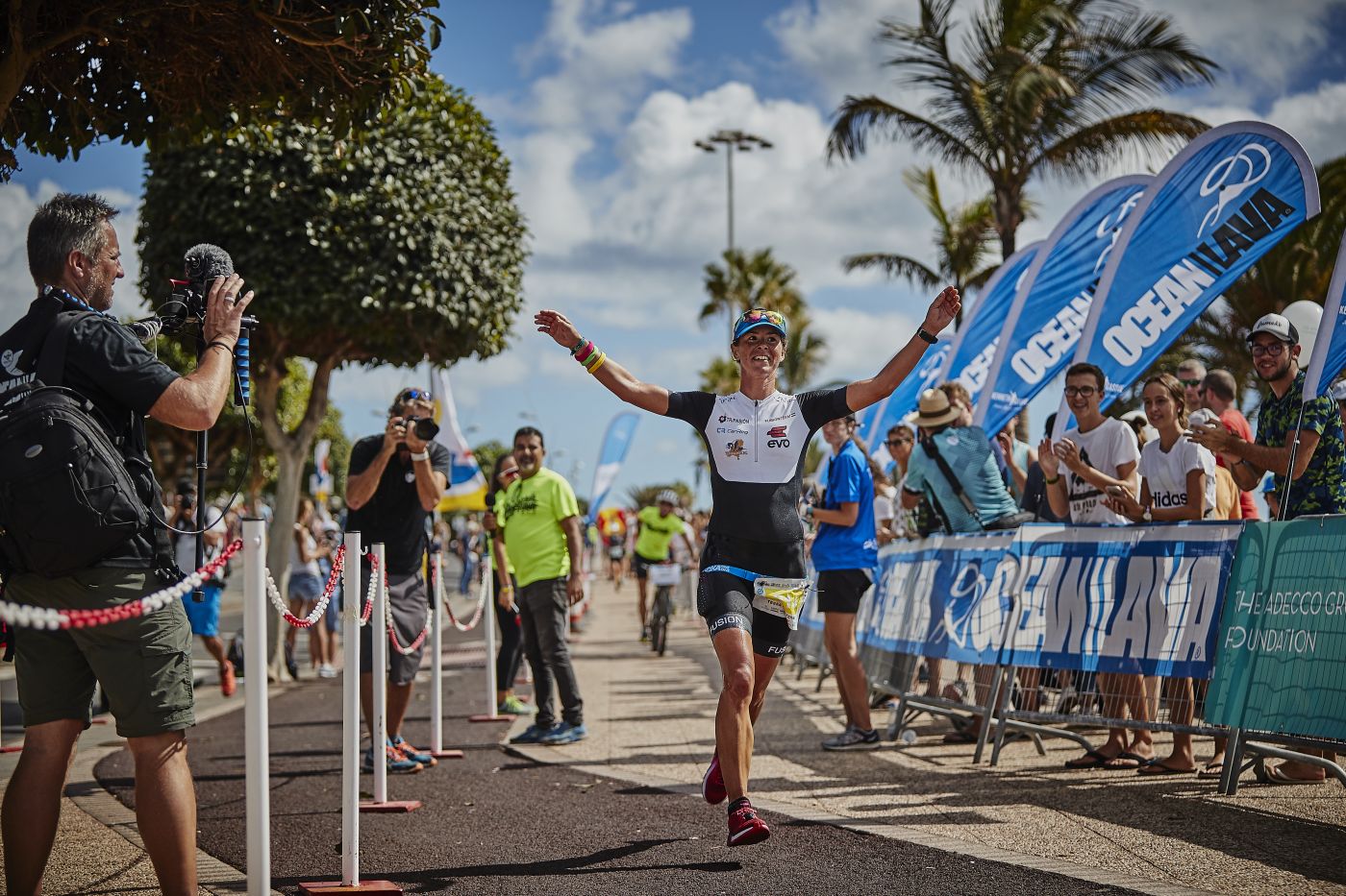 Athlete celebrating at the Ocean Lava Lanzarote finish line in Puerto del Carmen